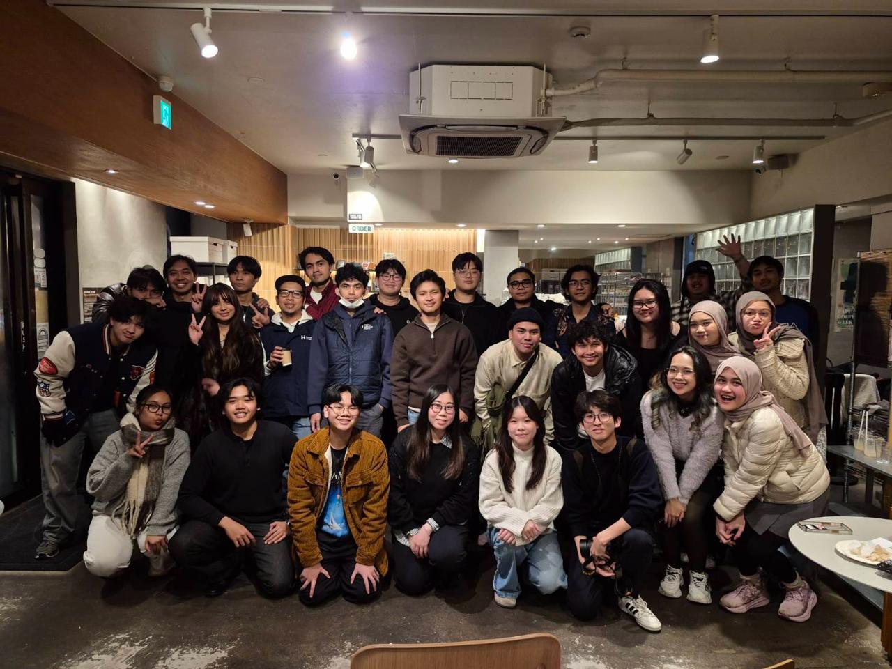 Group of diverse Indonesian students studying together abroad